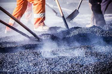 Asphalt team shovels new pour