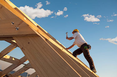 Custom builder installs roofing