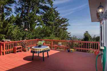 Painted second level deck with patio furniture