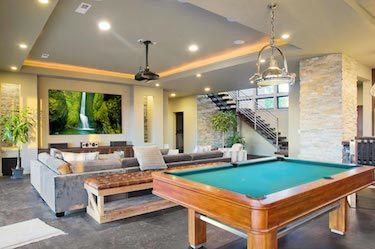 Pool table and theatre in large basement