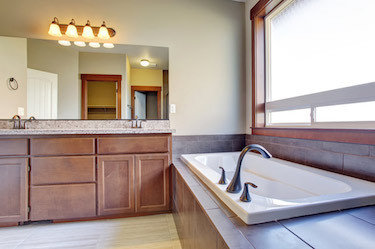 New bathroom renovation with warm wood tones