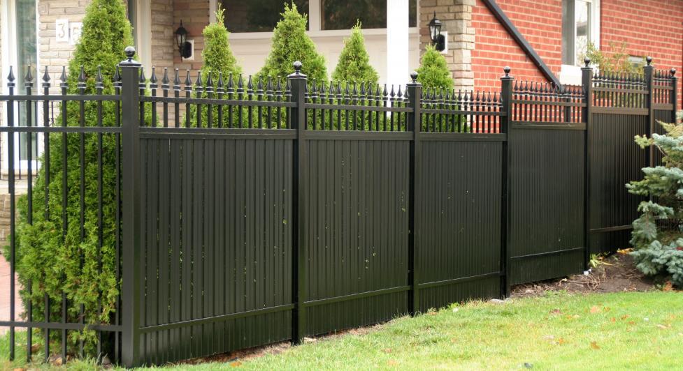 Aluminum privacy fence surrounding residential yard